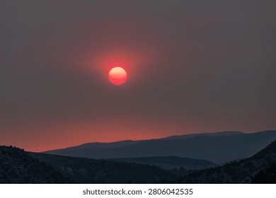 Wildfire enhanced sunset and cloudscape over Grass Valley in western Colorado on June 28, 2026.