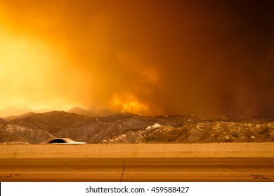 Wildfire In The Mountains Near Freeway. Brush Fire. Forest Fire.