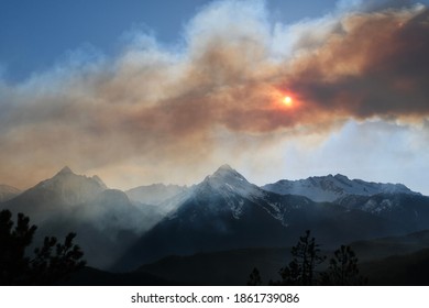 Wildfire In Mountains. Sun Thruth The Smoke Of Forest Fire Near Vancouver. British Columbia. Canada. 