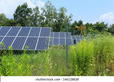 Wildflowers on the Meadow in front of the Solar Power Station - Shutterstock ID 146128838