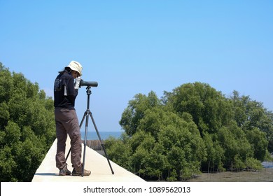 Wildlife Biologist Female With Monocular