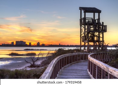 A wildlife observation tower silhouetted against a Perdido Key  sunset in Big Lagoon State Park near Pensacola, Florida