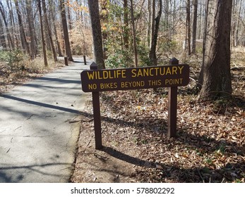 Wildlife Sanctuary Sign In The Woods With Walking Trail