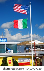 Wildwood, NJ, USA August 23 An American And Italian Flag Fly Over A Store On The Boardwalk In Wildwood, New Jersey 