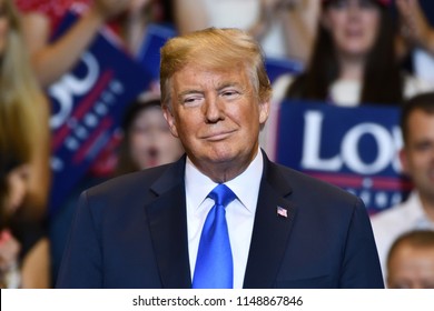 WILKES-BARRE, PA - AUGUST 2, 2018: President Donald Trump Stands On Stage Looking To His Right As Congressman Lou Barletta Delivers A Campaign Speech. 