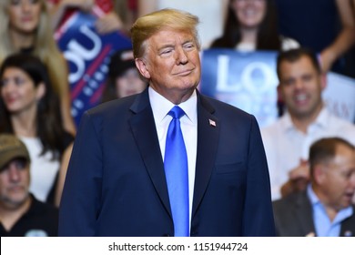 WILKES-BARRE, PA - AUGUST 2, 2018: President Donald Trump Listens On Stage Looking To His Left As Congressman Lou Barletta Delivers A Campaign Speech.