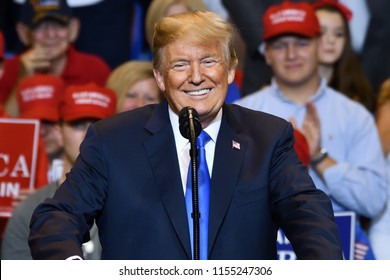 WILKES-BARRE, PA - AUGUST 2, 2018: President Donald Trump portrait smiling at the crowd during a campaign rally for Congressman Lou Barletta held at the Mohegan Sun Arena.