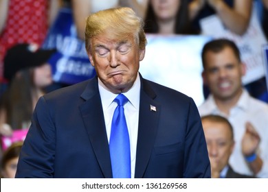 WILKES-BARRE, PA - AUGUST 2, 2018:  President Trump On Stage Reacts As He Listens To Congressman Lou Barletta Speak To The Crowd At His Campaign Rally.