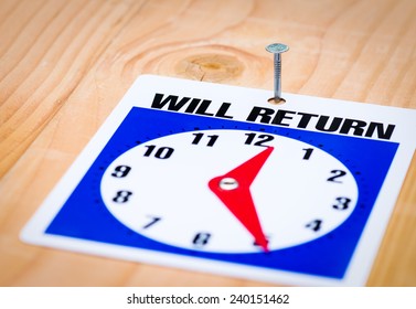 Will Return Time Sign Nailed To A Wood Plank