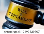 Will and testament text engraved on lawyer gavel. Law concept.