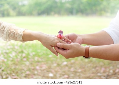 Will You Marry Me? , Man Putting Candy Ring On Woman Finger 