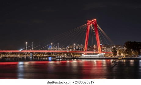 The Willemsbrug: A Striking Red Cable-Stayed Bridge Over the Nieuwe Maas in Rotterdam, Netherlands - Powered by Shutterstock