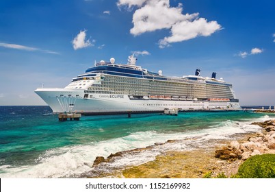 WILLEMSTAD, CURACAO - APRIL 10, 2018: Cruise ship Celebrity Eclipse docked at port Willemstad. The island is a popular Caribbean cruise destination