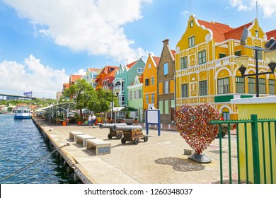 Willemstad, Curacao. Dutch Antilles.  Colourful Buildings attracting tourists from all over the world. Blue sky sunny day.