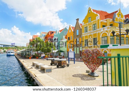 Willemstad, Curacao. Dutch Antilles.  Colourful Buildings attracting tourists from all over the world. Blue sky sunny day.