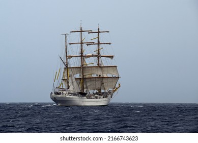 Willemstad, Curacao - June 12, 2022: Mexican Navy training vessel ARM Cuauhtémoc running rigging preparing to hoist sails during sail away at the Velas Latinoamérica Curaçao 2022 festival in Curacao