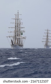 Willemstad, Curacao - June 12, 2022: Cisne Branco followed by ARM Cuauhtémoc running rigging preparing to hoist sails during; sail away the Velas Latinoamérica Curaçao 2022 festival in Curacao 