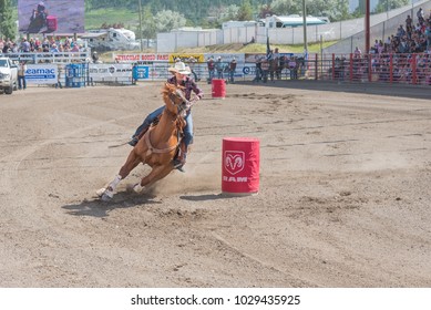 Williams Lake, British Columbia/Canada - July 2, 2016: Horse And Cowgirl Take A Tight Turn Around A Barrel At The 90th Williams Lake Stampede, One Of The Largest Stampedes In North America