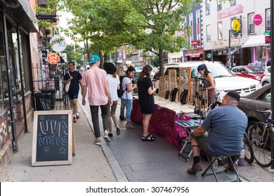 WILLIAMSBURG BROOKLYN, UNITED STATES - JUNE 21, 2015: Williamsburg  is attributed to be the place of origin of electroclash, and has a large local art community and hipster culture.