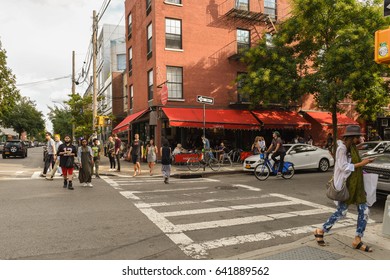 Williamsburg, Brooklyn, United States - September 3, 2016: People are walking along Bedford Avenue in Williamsburg, Brooklyn on a beautiful Weekend afternoon.