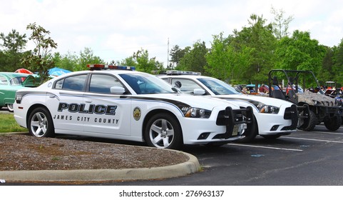 WILLIAMSBURG, VA - May 9, 2015: James City County Police Cars On Display At The 
6th Annual Project Lifesaver Car Show In Williamsburg Virginia On A Summer Day.