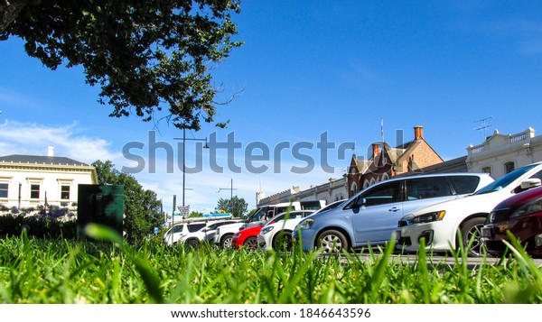Williamstown, AU - 4 Jan 2018: A shot of crowded\
parking lot. The cars are parked in an angled row. Williamstown is\
named after king Williams IV. This is a historic town with strong\
maritime presence