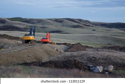 WILLISTON, NORTH DAKOTA - MAY 3:  Bulldozers break more ground near Williston, ND, May 3, 2010.  Oil discoveries have led to massive development and job creation according to a news source