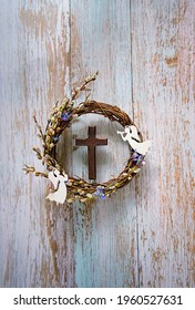 Willow Wreath, Cross And Angels Decor On Rustic Wooden Background. Easter, Palm Sunday Holiday. Prayer, Faith, Spiritual Life, Orthodox Church, Religion Concept. Flat Lay