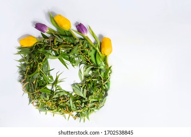 Willow Wreath With Spring Flowers As Decoration.