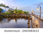 Wilmington, North Carolina, USA on the Riverwalk at twilight.