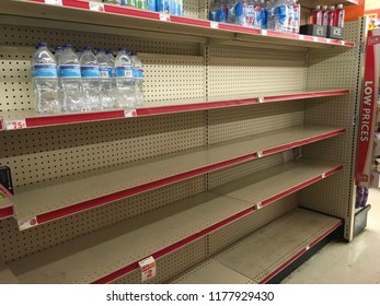 Wilmington North Carolina, USA / September 12, 2018. Nearly Empty Shelves In Local Family Dollar On Market Street. Bought Out For Hurricane Florence