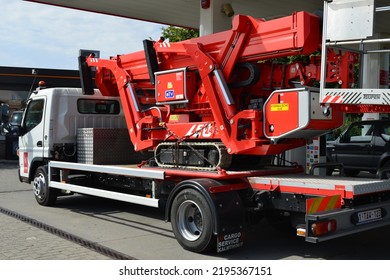 Wilsele, Vlaams-Brabant, Belgium - August, 29, 2022: Petrol Gas Station LUKoil. Side View On Refueling Parked Transport Fugo Truck With A Little Excavator On A Trailer