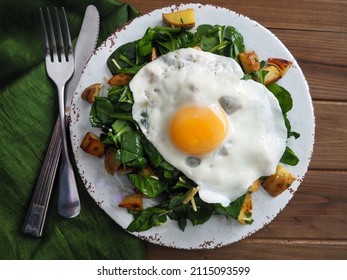 Wilted Warm Spinach Potato Salad With A Fried Egg