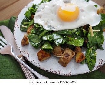 Wilted Warm Spinach Potato Salad With A Fried Egg On Top