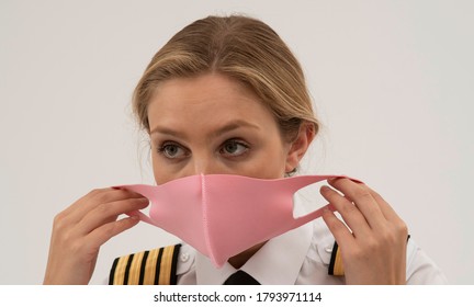 Wiltshire, England, UK. August 2020.  Airline Pilot Wearing A Face Mask During The Covid-19 Lockdown.