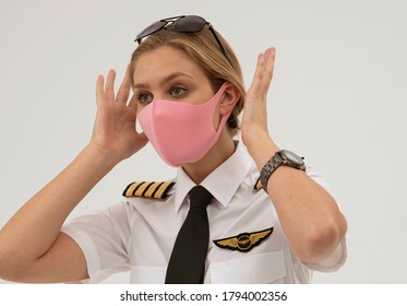 Wiltshire, England, UK. August 2020.  Airline Pilot Wearing A Face Mask During The Covid-19 Lockdown.