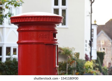 Wiltshire, United Kingdom. October 24 2019. A Traditional Red Royal Mail Post Box / Mail Box In An English Town