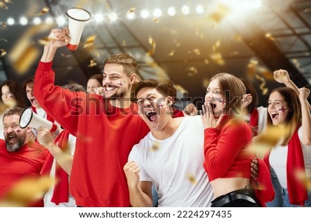 Win, goal. Group of happy thrilled excited soccer football fans cheering for their sport team victory. Concept of human emotions, global sports competitions, championship, ad. Red and white colors