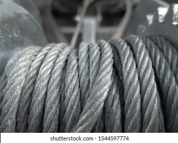 Winch With A Metal Cable. Coiled Metal Cable. Carelessly Twisted Metal Cable