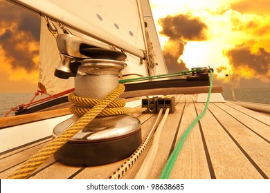 Winch With Rope On Sailing Boat In The Sea At Sunset