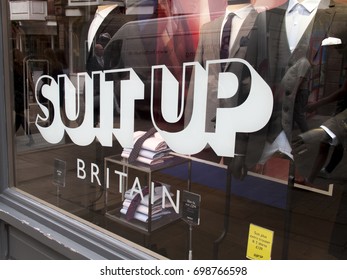 Winchester, Hampshire, England - August 14, 2017: Moss Bros Suit Up Britain Advertising Campaign In Retail Shop Window, UK Menswear Company Founded In 1851by Mosses Moss