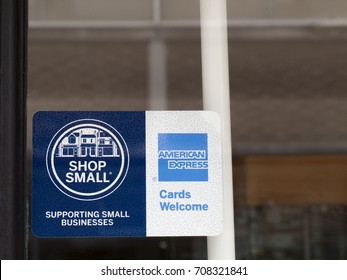 Winchester, Hampshire, England - August 14, 2017: Shop Small And American Express Cards Welcome Sign In Retail Shop Window