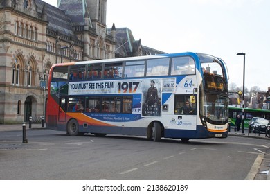 Winchester, Hampshire, UK 02 08 2020 A Bus Turns In The Round In Winchester With A Movie Promotion On Its Side