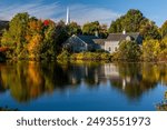 Winchester, MA USA 10-09-2009: Early morning light creates a classic New England tableau at Judkins Pond in Winchester, Massachusetts.