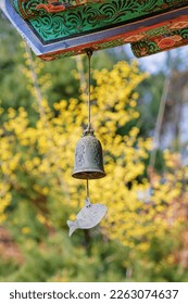 Wind bell at the end of eaves and Cornelius Flowers in Bongeunsa Temple, Seoul