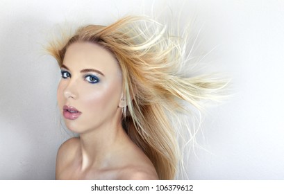 Wind blowing through hair of beautiful Caucasian teenage model - Shutterstock ID 106379612