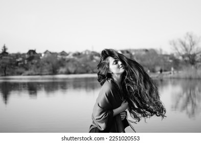 Wind blows on hair.Hair fell over her face.Girl with long curly hair.Live photo in motion.Happy photo.Emotions and movements.The girl shakes her head.Twisted hair.
Beautiful black and white portrait. 
