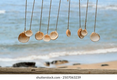 A wind chime made of shells at the vacation beach bar, relax and unwind on your summer holiday.