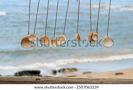 A wind chime made of shells at the vacation beach bar, relax and unwind on your summer holiday.