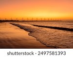 Wind energy. Dusk after sunset behind the wind energy farm on Icaraí de Amontada beach, CE, Brazil, on July 1, 2024.